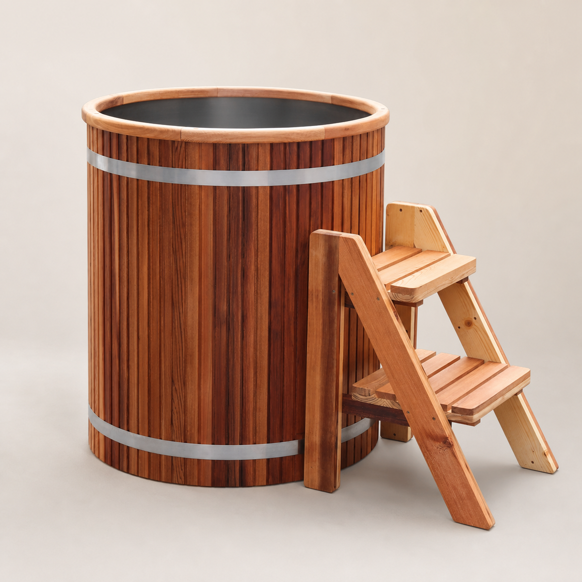 Elevn Nordic cedar and stainless-steel cold plunge barrel with wooden steps, clean studio view
