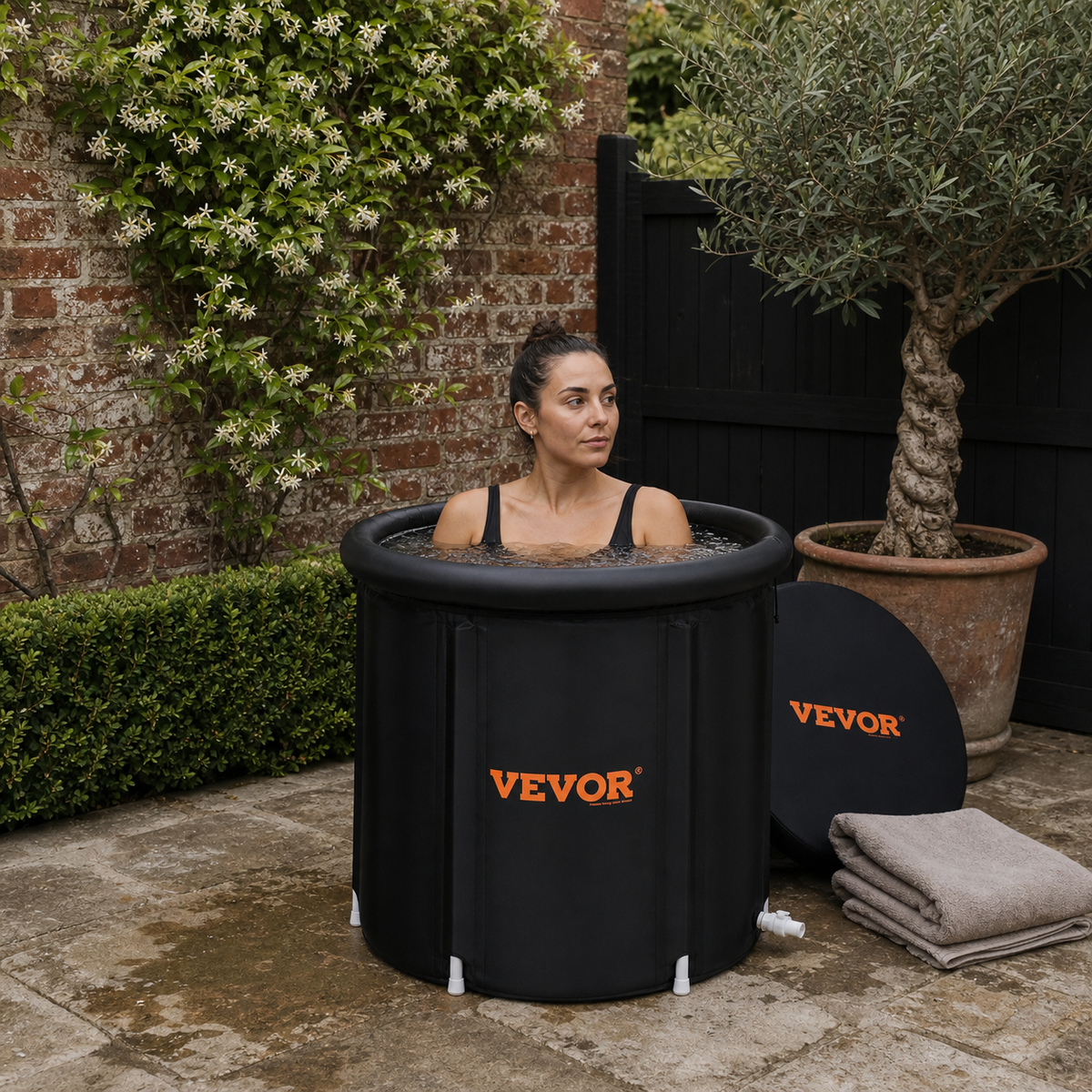 Elevn Reset portable ice bath in a British courtyard garden